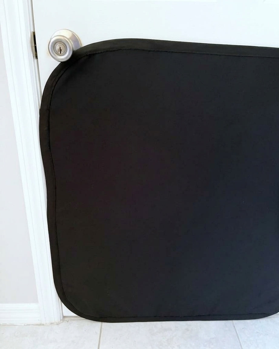 Clawstopper door scratch protector installed on a white interior door, clamped at the edges with no screws