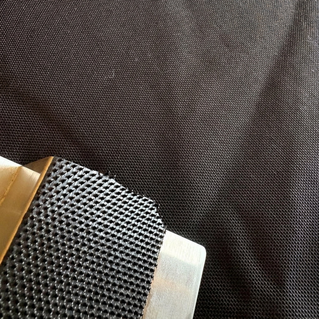 Close-up of the tough woven Cordura fabric used in Clawstopper, next to the clamp grip pad