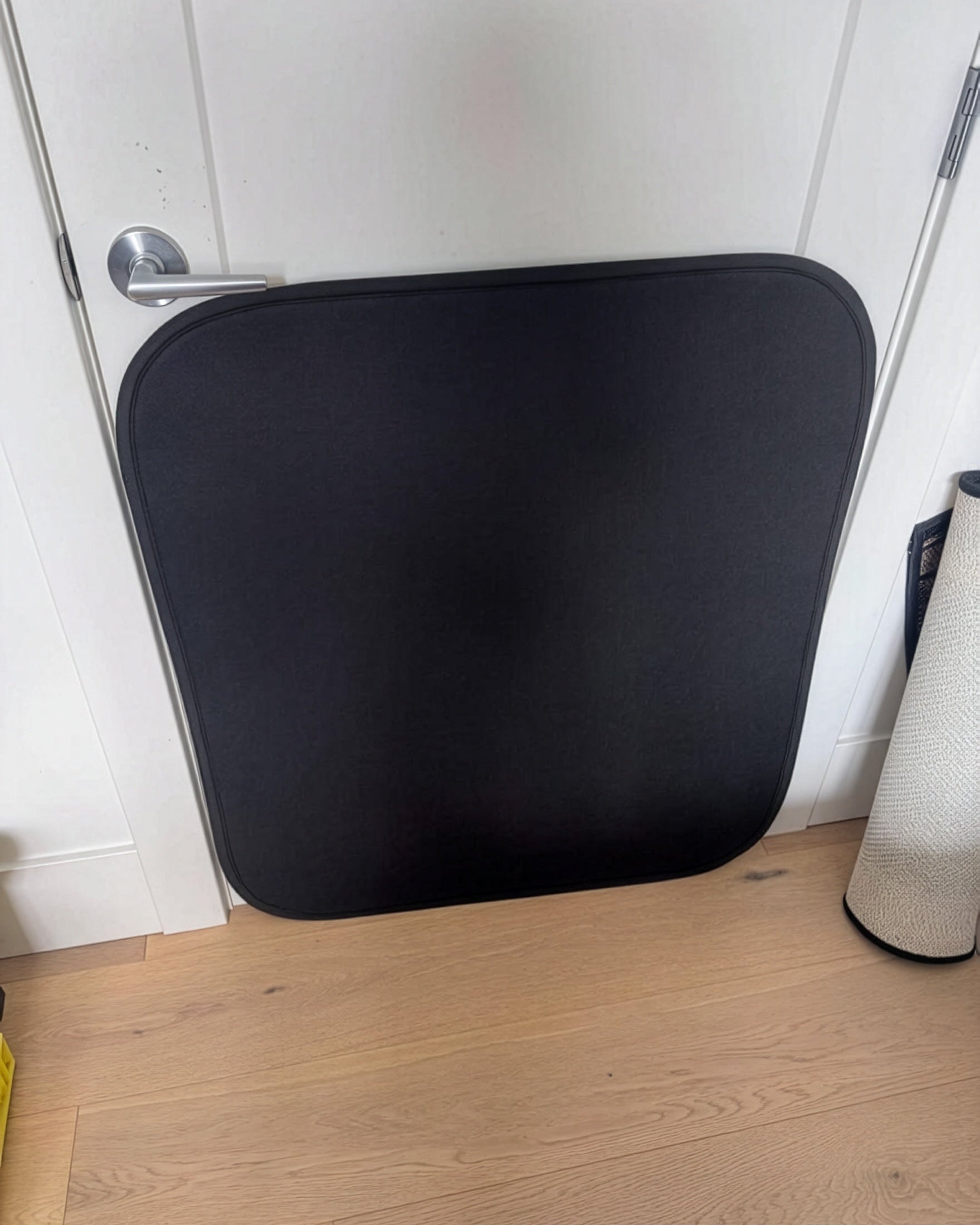 Clawstopper door protector for dog scratching installed on white residential interior door